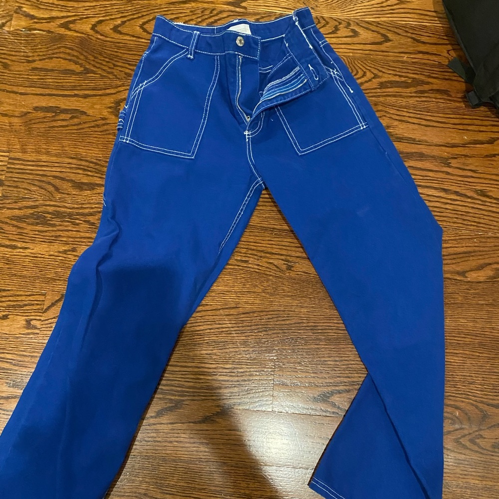 Bright blue Zara jeans with white detail stitching